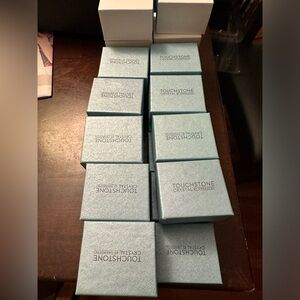 Touchstone Crystal.  25 ring boxes.  Six have sleeves, the rest do not.